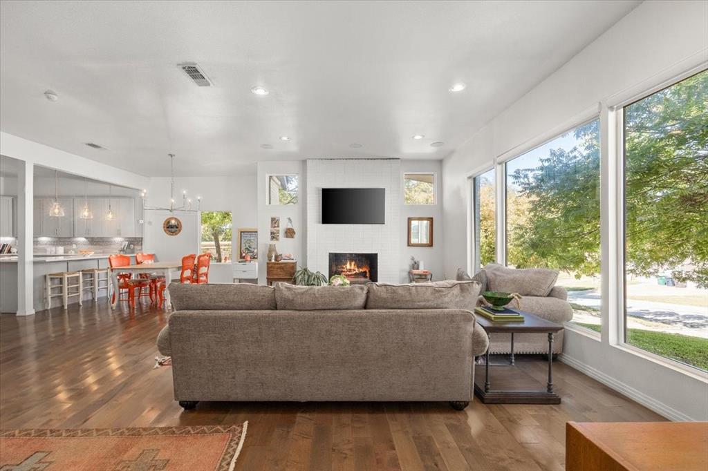 6121 Sharon Road Fort Worth, TX 76116 - Photo 7 of 37 a living room with fireplace furniture and a large window