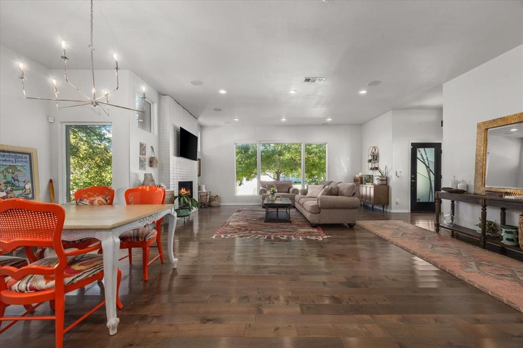 6121 Sharon Road Fort Worth, TX 76116 - Photo 8 of 37 a living room with fireplace furniture and a large window