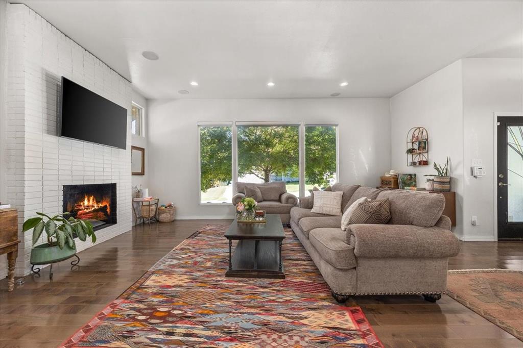 6121 Sharon Road Fort Worth, TX 76116 - Photo 9 of 37 a living room with furniture fireplace and a flat screen tv