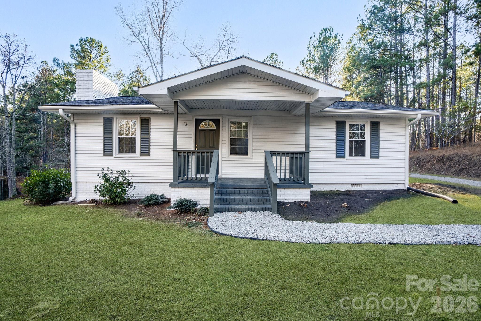 28 Robert Tyson Road Wadesboro, NC 28170 - Photo 1 of 23 a front view of a house with a yard
