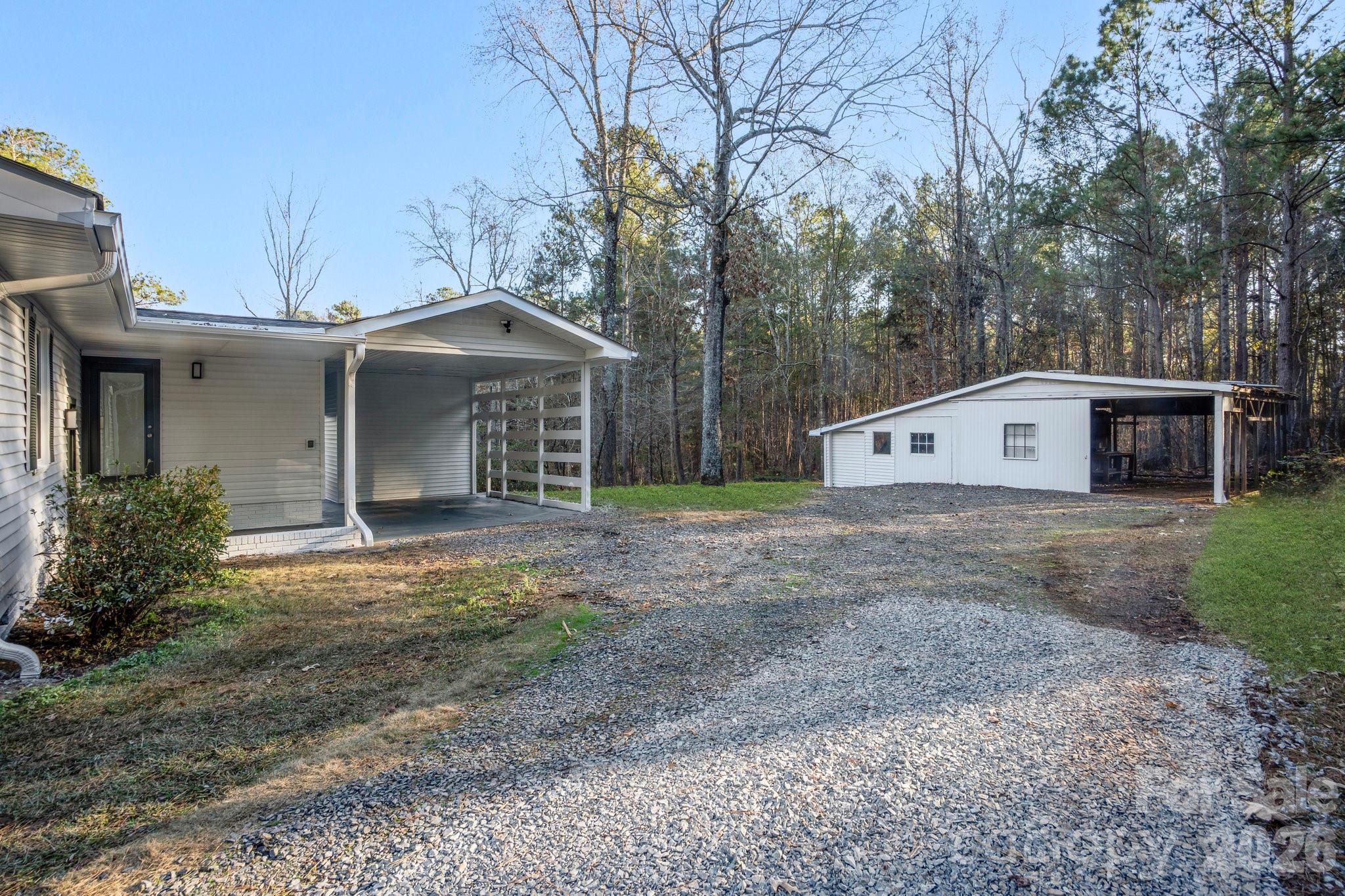 28 Robert Tyson Road Wadesboro, NC 28170 - Photo 19 of 23 a front view of a house with garden