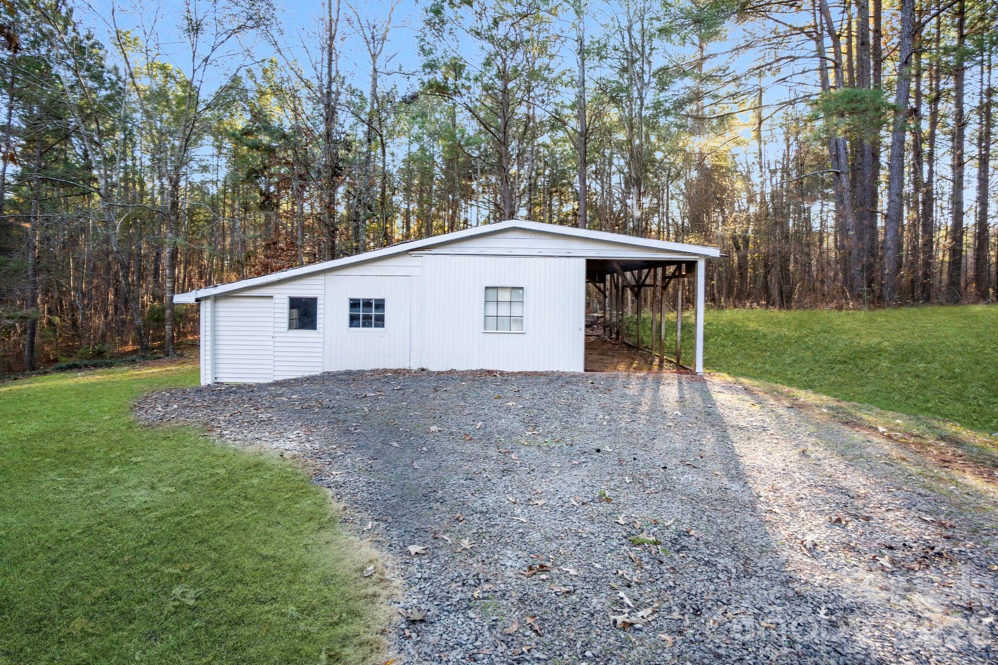 28 Robert Tyson Road Wadesboro, NC 28170 - Photo 20 of 23 a view of a house with backyard and trees