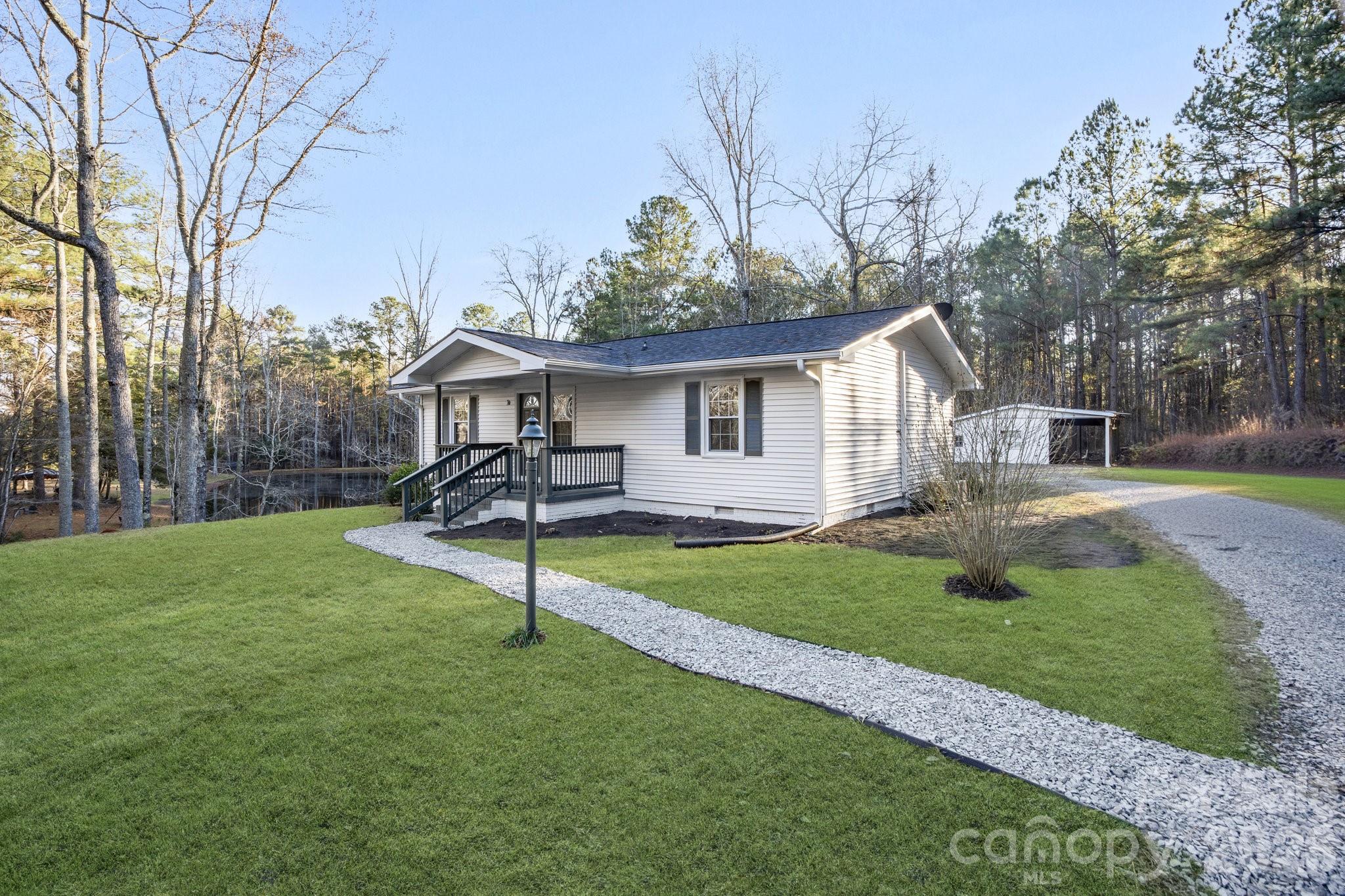 28 Robert Tyson Road Wadesboro, NC 28170 - Photo 2 of 23 a view of a house with a yard and sitting area
