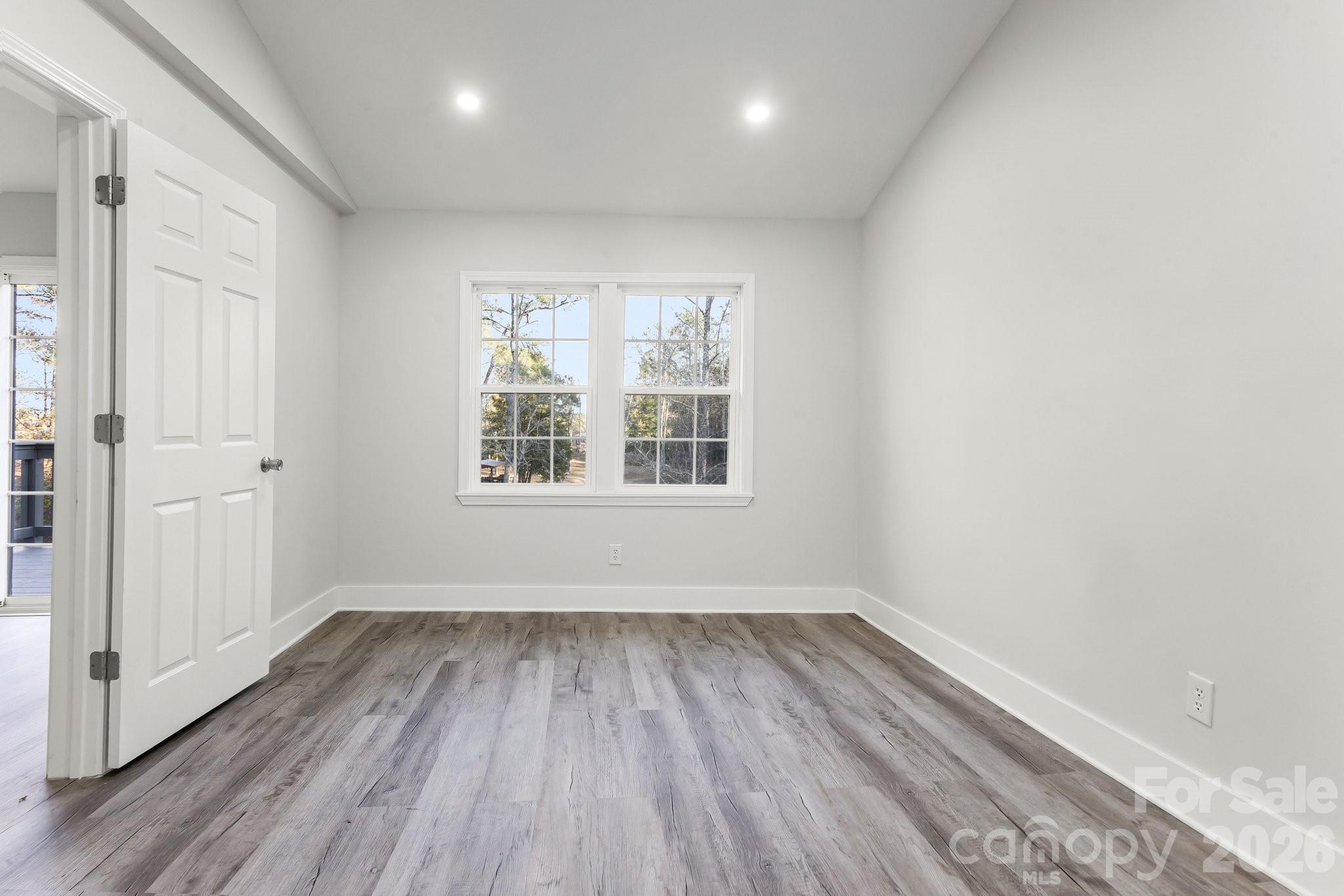 28 Robert Tyson Road Wadesboro, NC 28170 - Photo 9 of 23 wooden floor in an empty room with a window