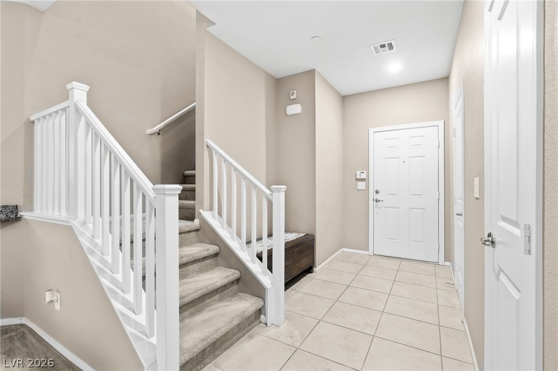 150 Fulgora Street Henderson, NV 89074 - Photo 25 of 92 Entryway with stairs and light tile patterned floors