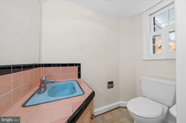 a bathroom with a sink toilet and tub