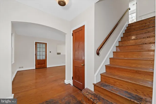 a view of an entryway with wooden floor