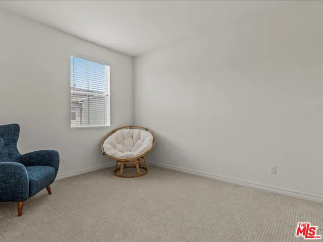 a room with furniture a window and a couch