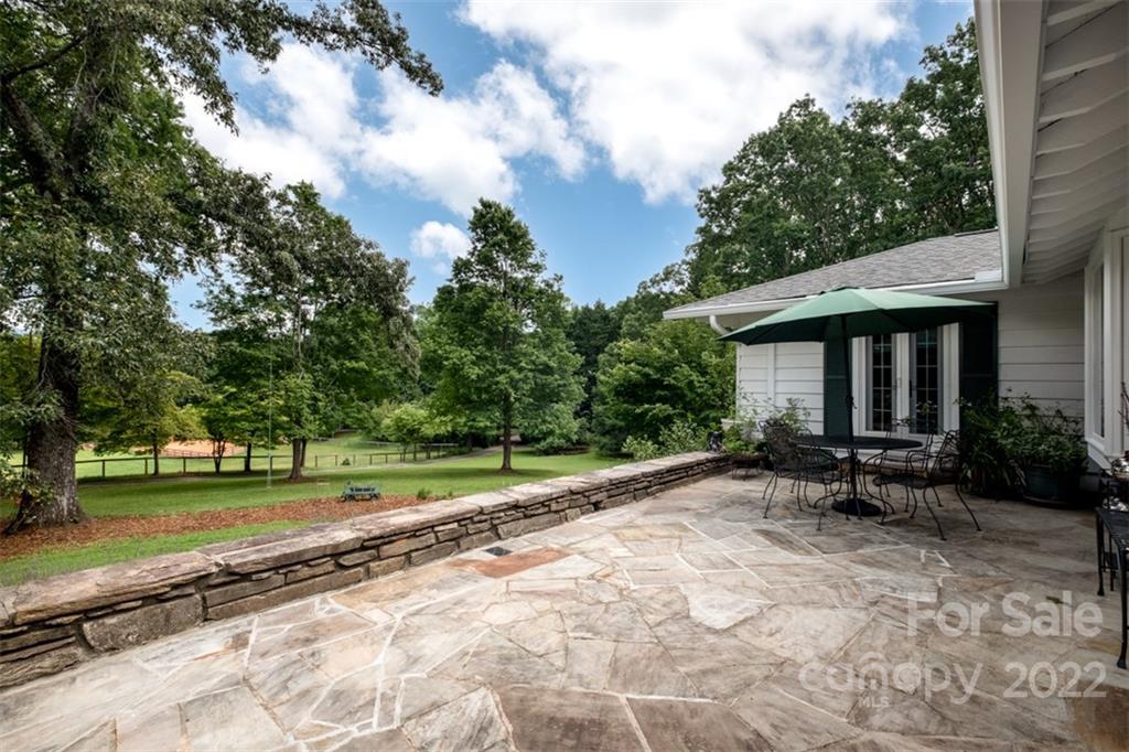 252 Hillbrook Road Tryon, NC 28782 - Photo 13 of 48 a view of a house with backyard and sitting area