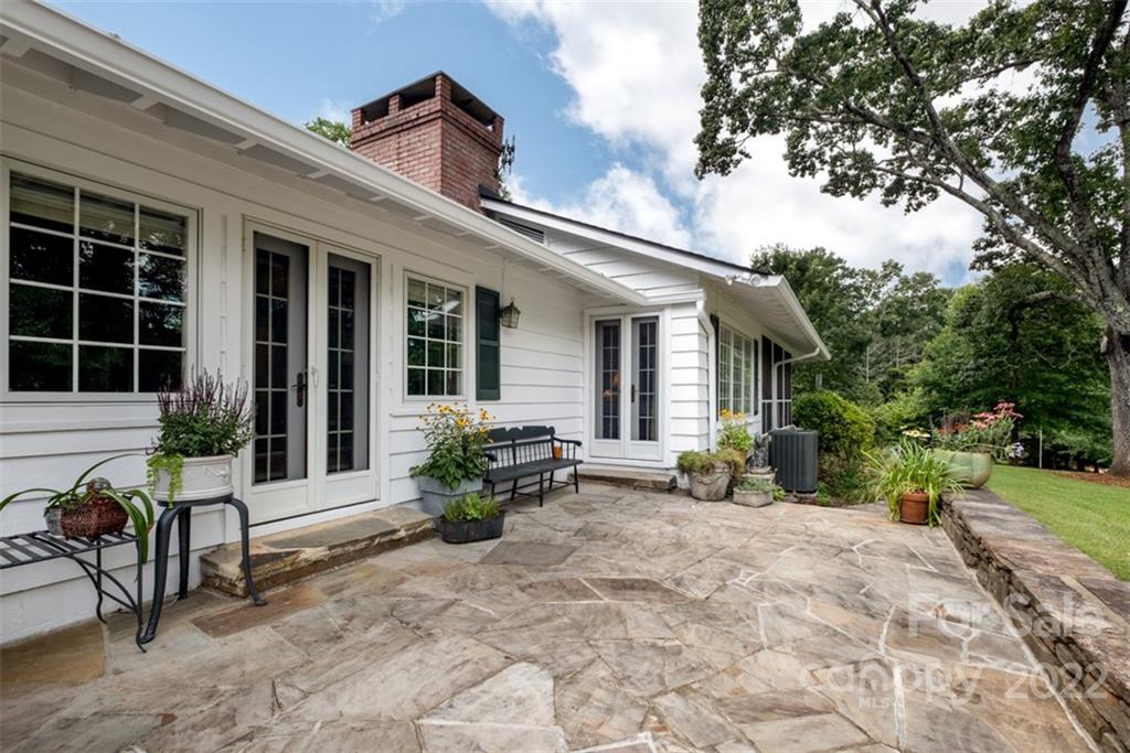 252 Hillbrook Road Tryon, NC 28782 - Photo 14 of 48 a view of a house with backyard and sitting area