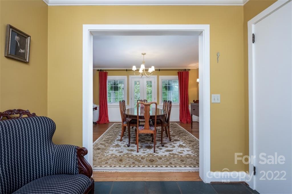 252 Hillbrook Road Tryon, NC 28782 - Photo 16 of 48 a dining room with furniture and a chandelier