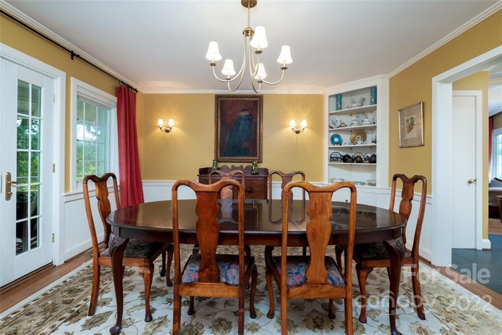 252 Hillbrook Road Tryon, NC 28782 - Photo 17 of 48 a view of a dining room with furniture and chandelier