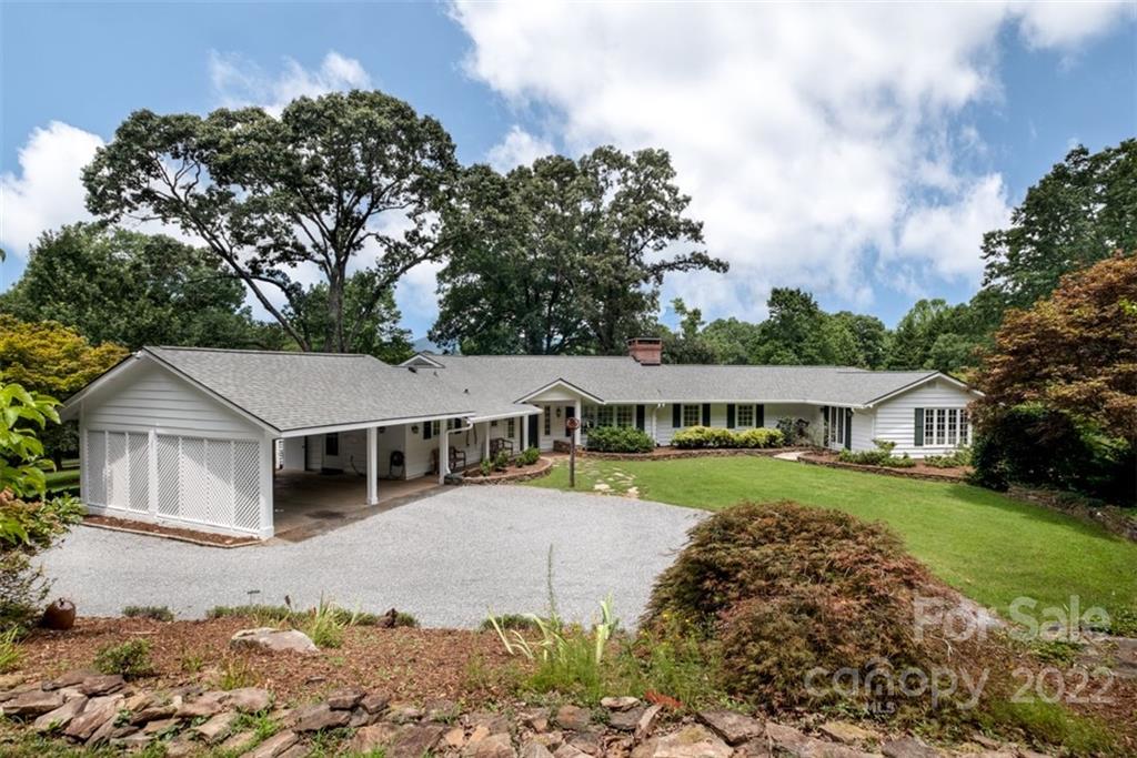 252 Hillbrook Road Tryon, NC 28782 - Photo 2 of 48 front view of a house with a yard