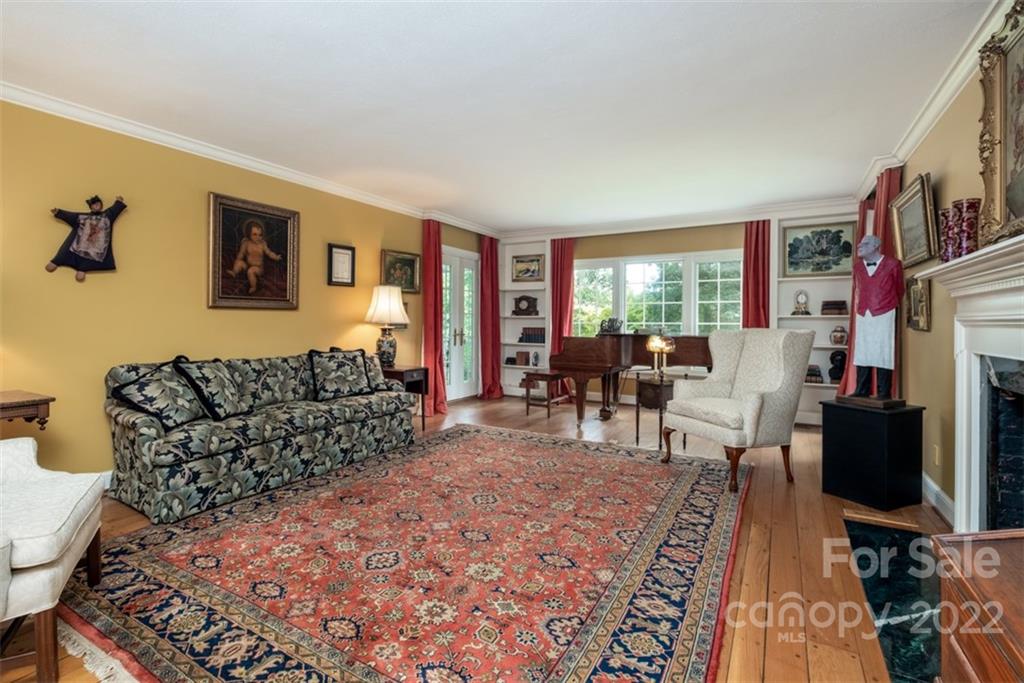 252 Hillbrook Road Tryon, NC 28782 - Photo 22 of 48 a living room with furniture a flat screen tv and a fireplace