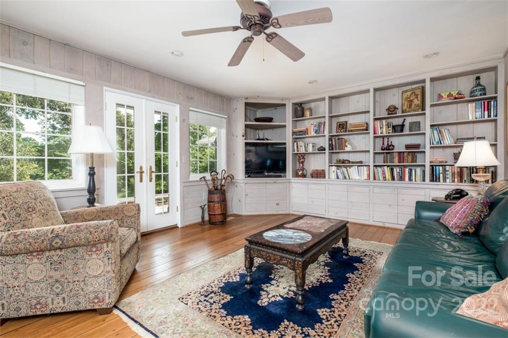 252 Hillbrook Road Tryon, NC 28782 - Photo 26 of 48 a living room with furniture and a book shelf