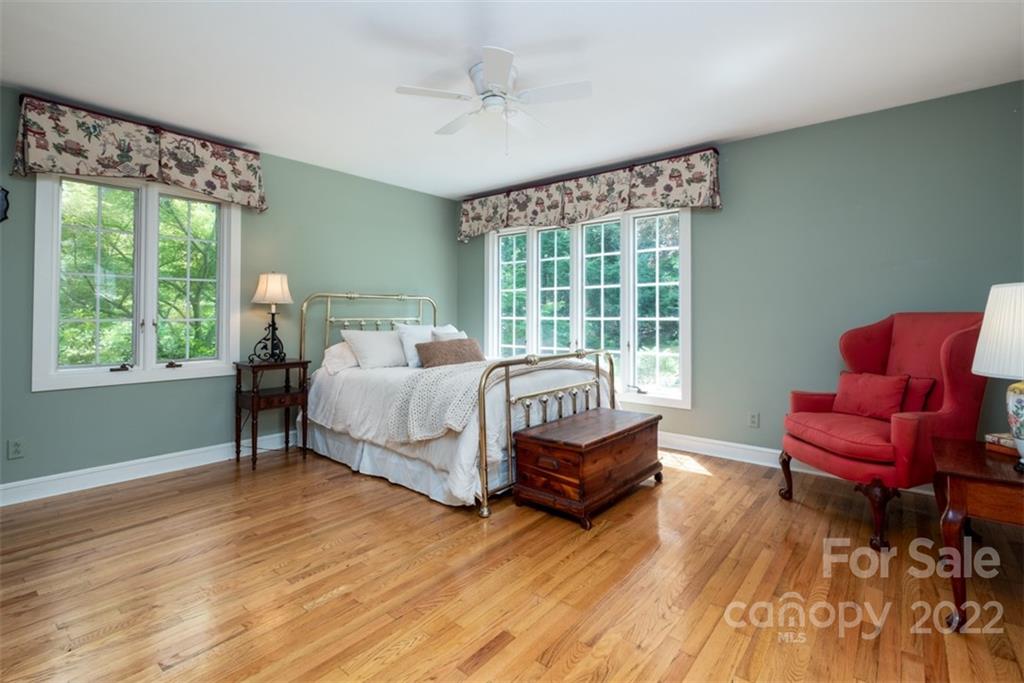 252 Hillbrook Road Tryon, NC 28782 - Photo 37 of 48 a bedroom with a bed and a couch