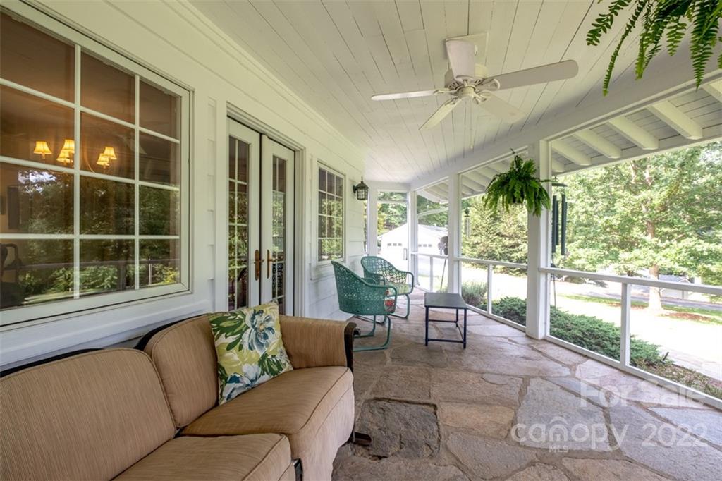 252 Hillbrook Road Tryon, NC 28782 - Photo 39 of 48 a balcony with furniture and a potted plant