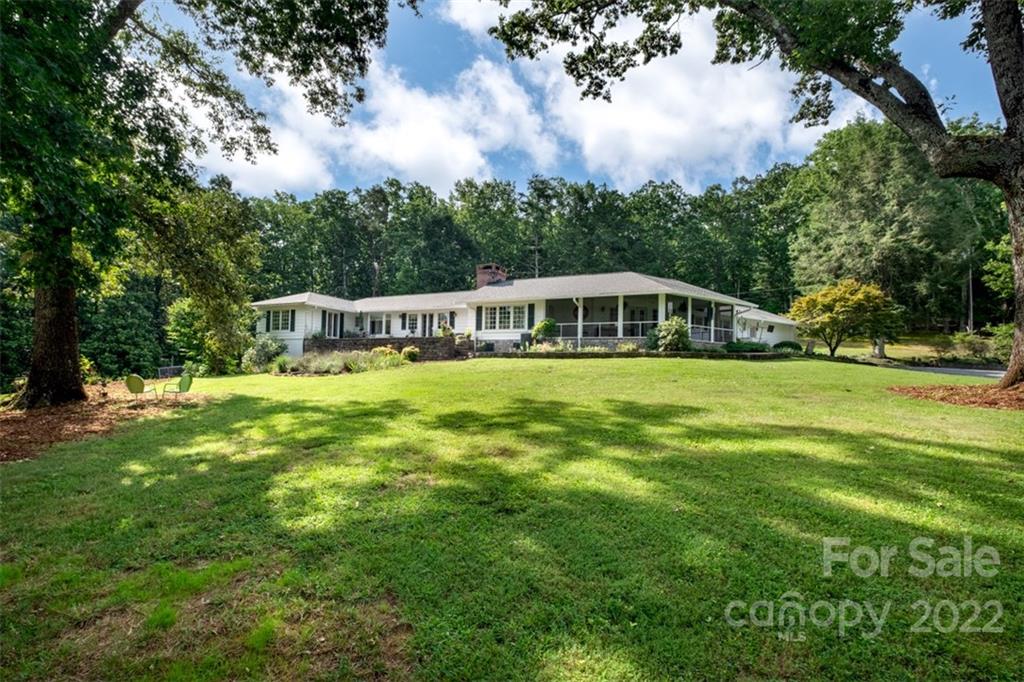 252 Hillbrook Road Tryon, NC 28782 - Photo 4 of 48 a view of a house with a big yard