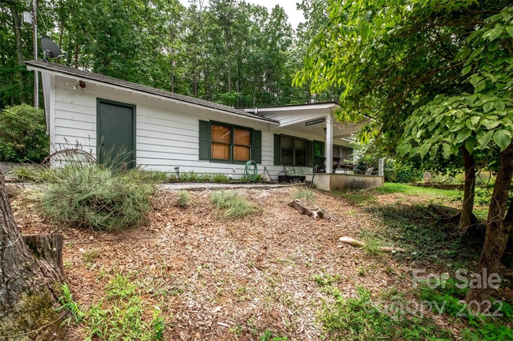 252 Hillbrook Road Tryon, NC 28782 - Photo 43 of 48 a view of a house with backyard