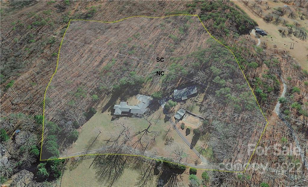 252 Hillbrook Road Tryon, NC 28782 - Photo 48 of 48 a view of a fireplace with a tree