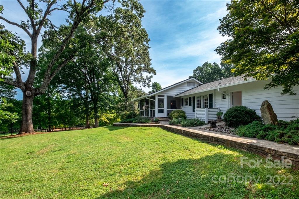 252 Hillbrook Road Tryon, NC 28782 - Photo 7 of 48 a front view of house with yard and green space