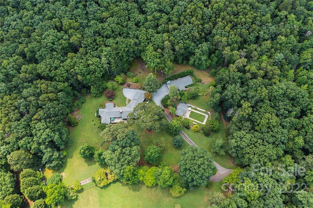 252 Hillbrook Road Tryon, NC 28782 - Photo 9 of 48 an aerial view of residential house with outdoor space and trees all around