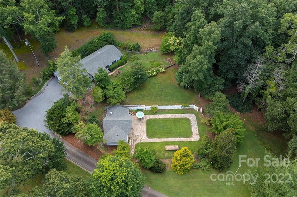 252 Hillbrook Road Tryon, NC 28782 - Photo 10 of 48 an aerial view of a house with a yard and lake view