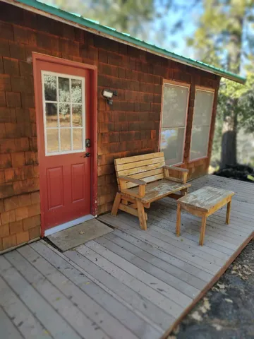 a backyard of a house with outdoor seating