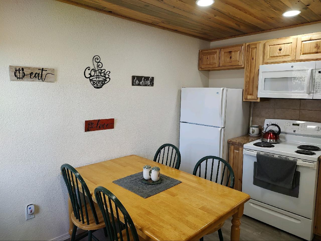 48753 Todd Eymann Road Miramonte, CA 93641 - Photo 4 of 11 a view of a dining table and chairs