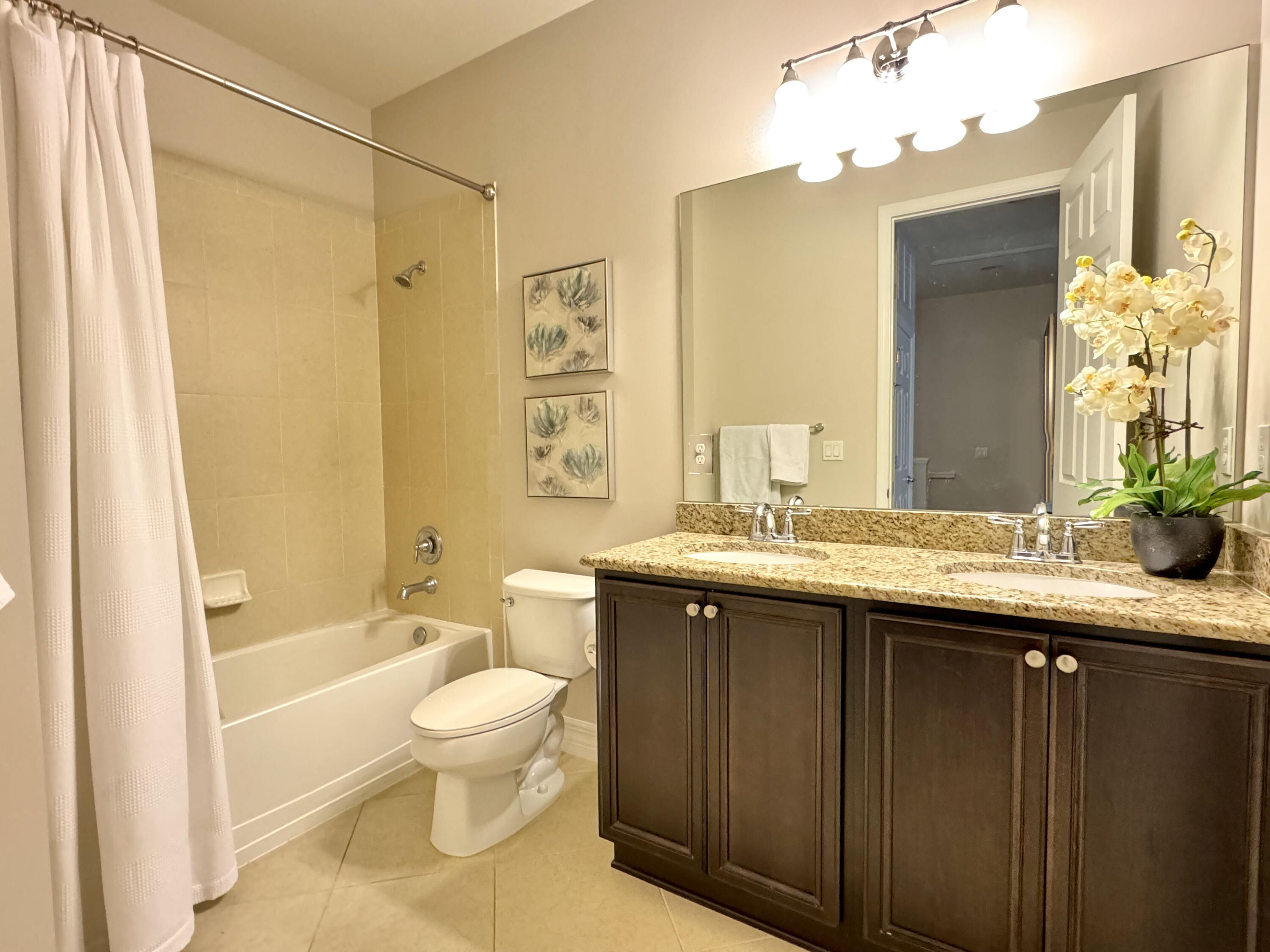 2758 Avalon Way Jupiter, FL 33458 - Photo 28 of 51 a bathroom with a granite countertop sink toilet and shower