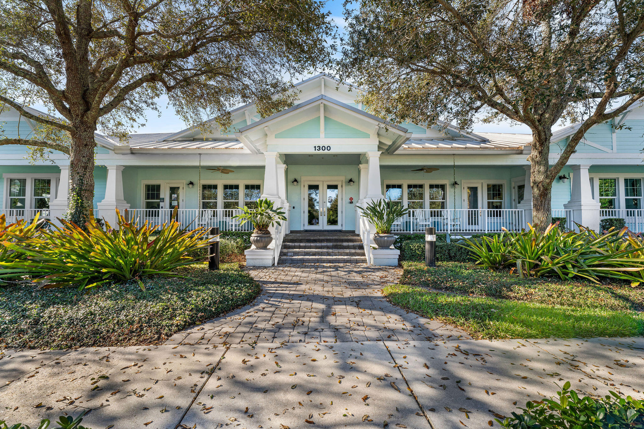 2758 Avalon Way Jupiter, FL 33458 - Photo 33 of 51 a front view of a house with garden and porch