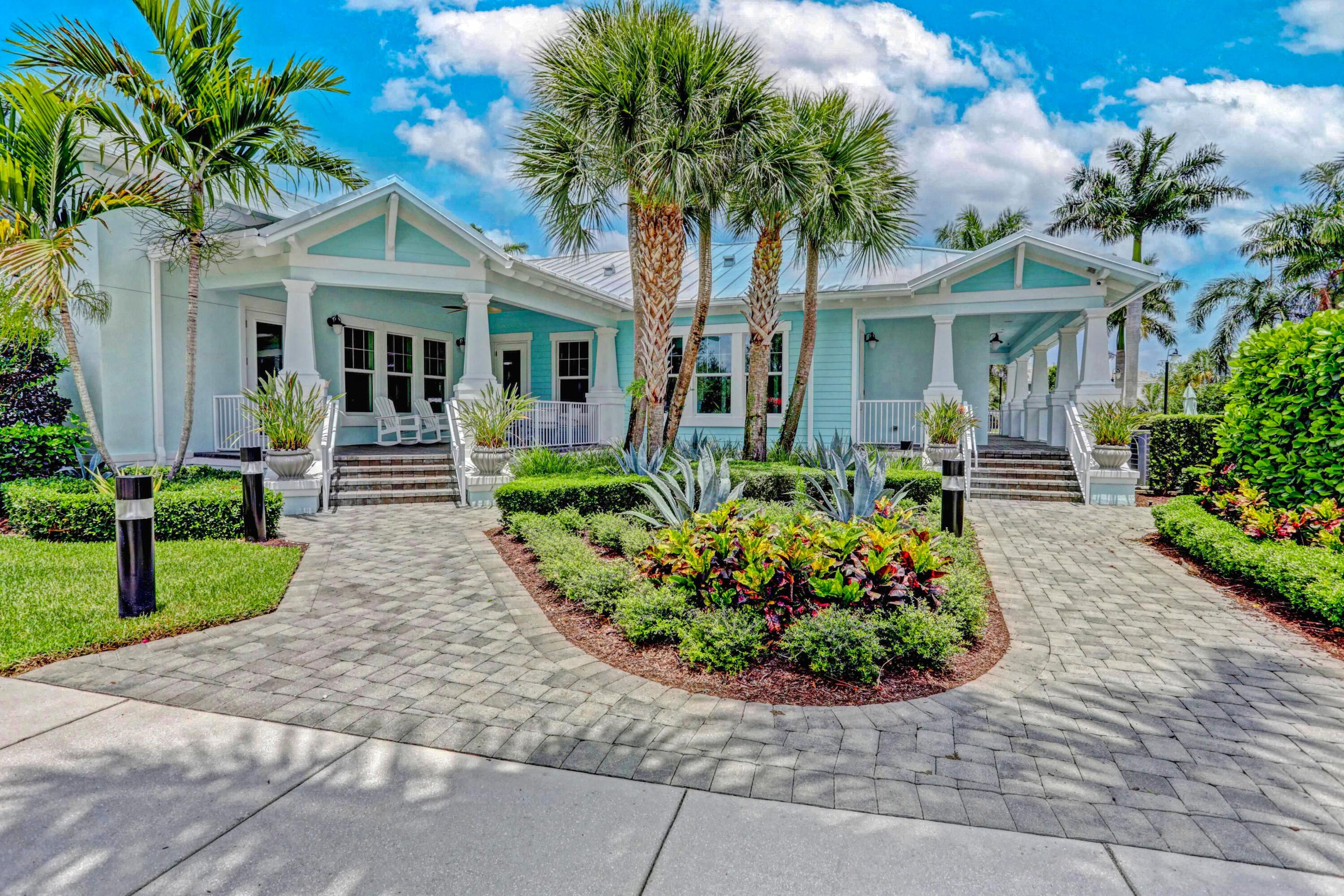 2758 Avalon Way Jupiter, FL 33458 - Photo 34 of 51 a front view of a house with a garden