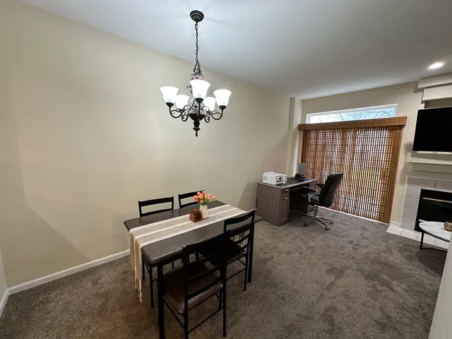 a view of a workspace with furniture