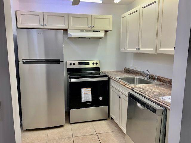 55 Mansfield B, Unit 55 Boca Raton, FL 33434 - Photo 2 of 19 a kitchen with stainless steel appliances granite countertop a refrigerator sink and cabinets