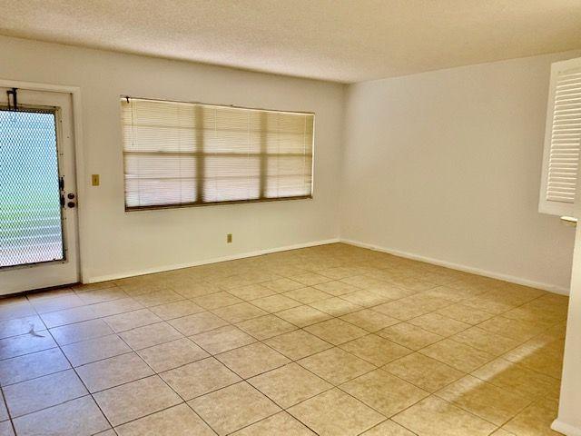 55 Mansfield B, Unit 55 Boca Raton, FL 33434 - Photo 5 of 19 an empty room with windows