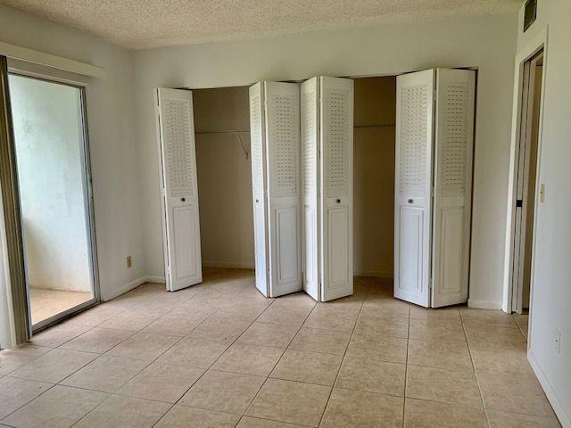55 Mansfield B, Unit 55 Boca Raton, FL 33434 - Photo 8 of 19 a view of an empty room with closet area