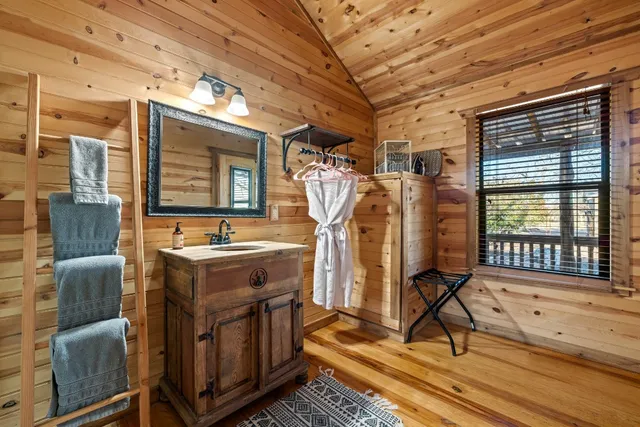 a bathroom with a toilet a sink and shower