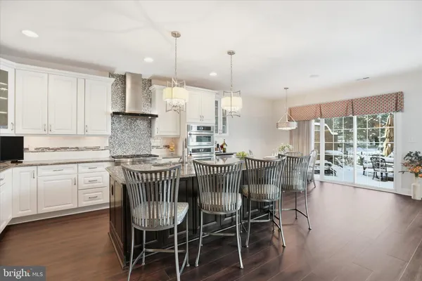 a kitchen with stainless steel appliances granite countertop a stove and a sink