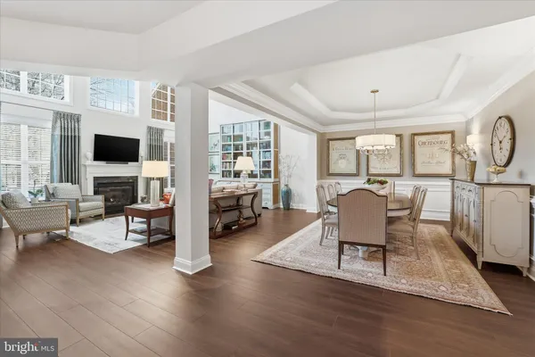 a bedroom with furniture and a large window