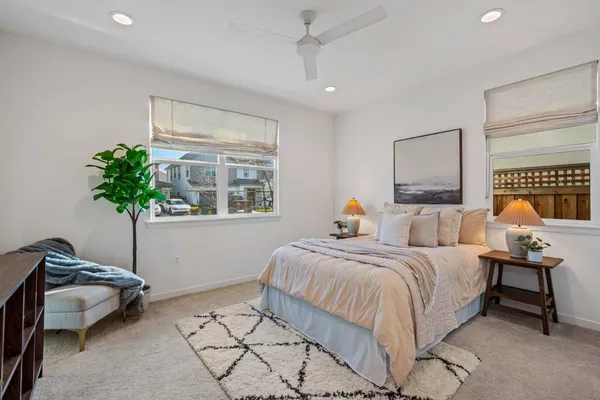 a bedroom with a bed and a couch