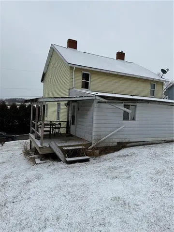 a front view of a house with parking