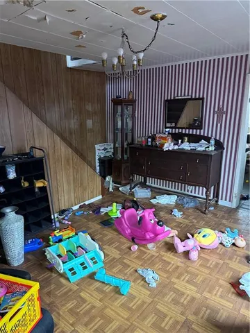 a bedroom with a bed table and a couch