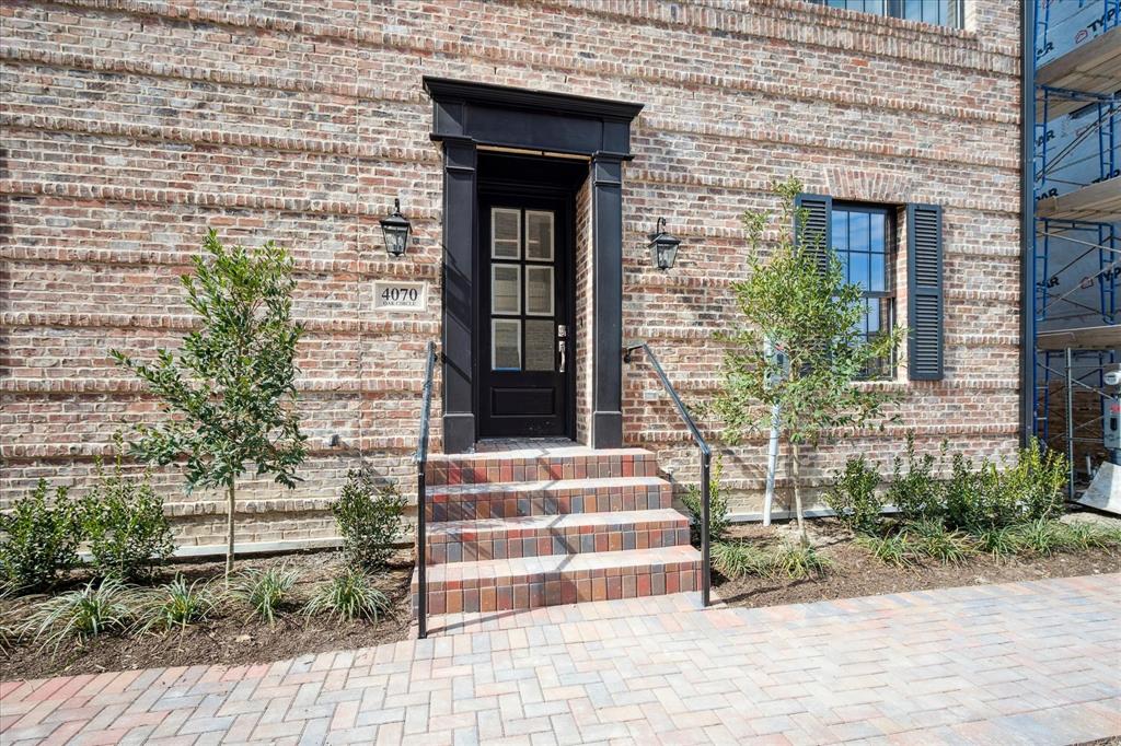 4070 Oak Circle Addison, TX 75001 - Photo 18 of 38 a front view of a house with a garden