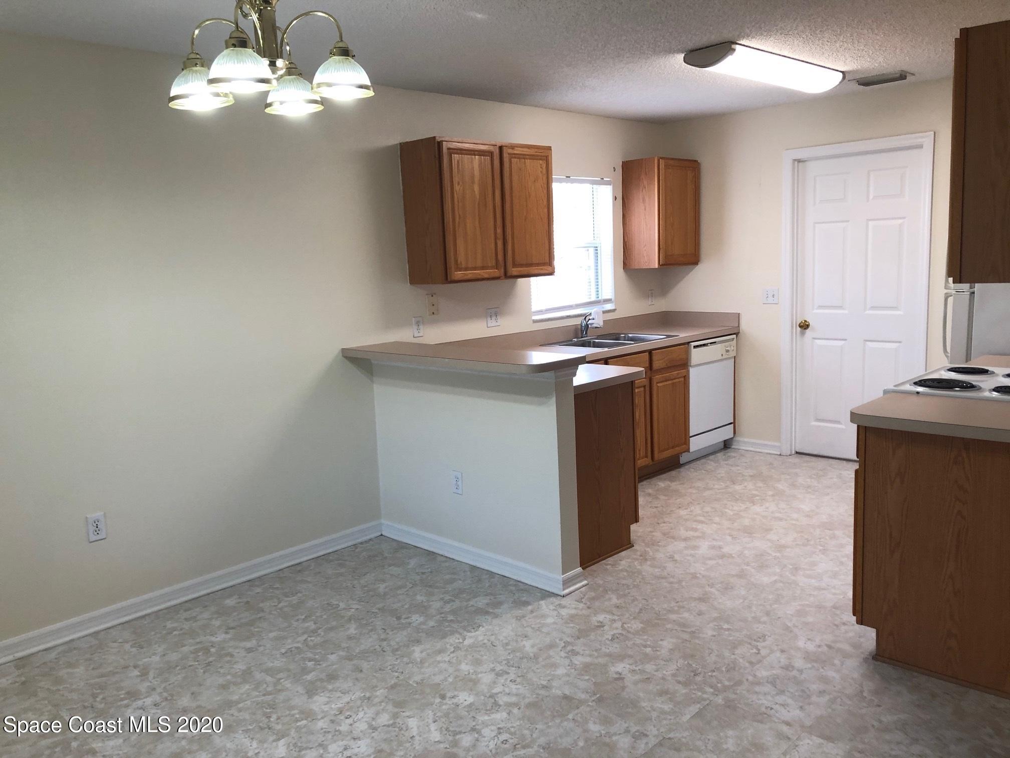 297 Butler Avenue Palm Bay, FL 32907 - Photo 9 of 20 297 dining-kitchen