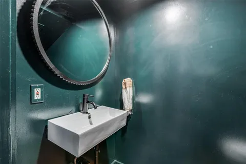a bathroom with a sink and mirror