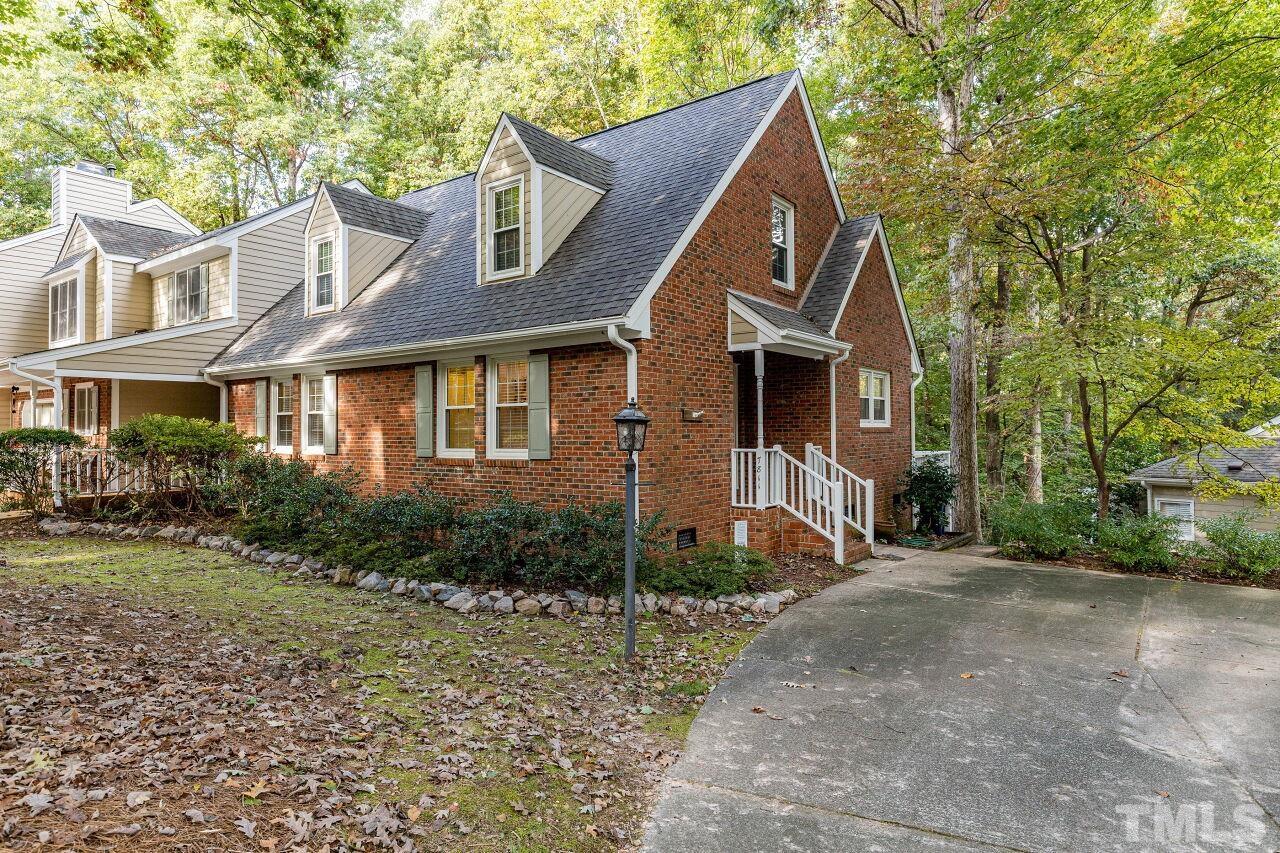 7811 Breckon Way Raleigh, NC 27615 - Photo 1 of 30 a front view of a house with garden