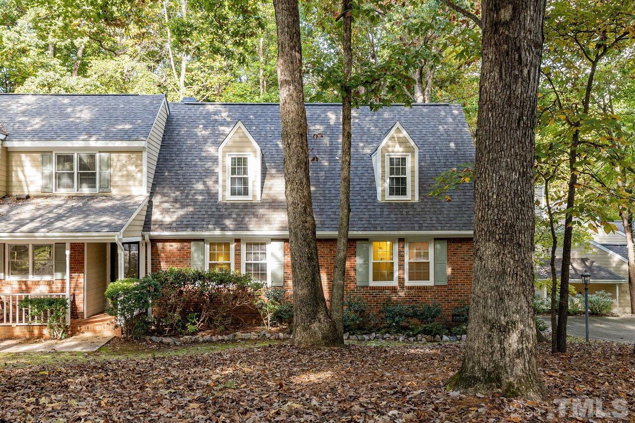 7811 Breckon Way Raleigh, NC 27615 - Photo 2 of 30 a front view of a house with a yard
