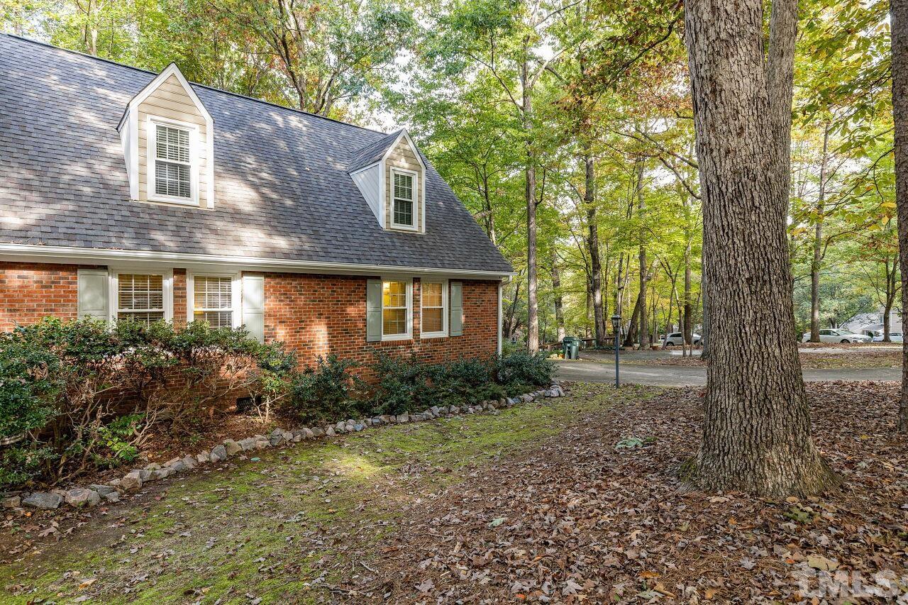 7811 Breckon Way Raleigh, NC 27615 - Photo 3 of 30 a view of a house with a yard