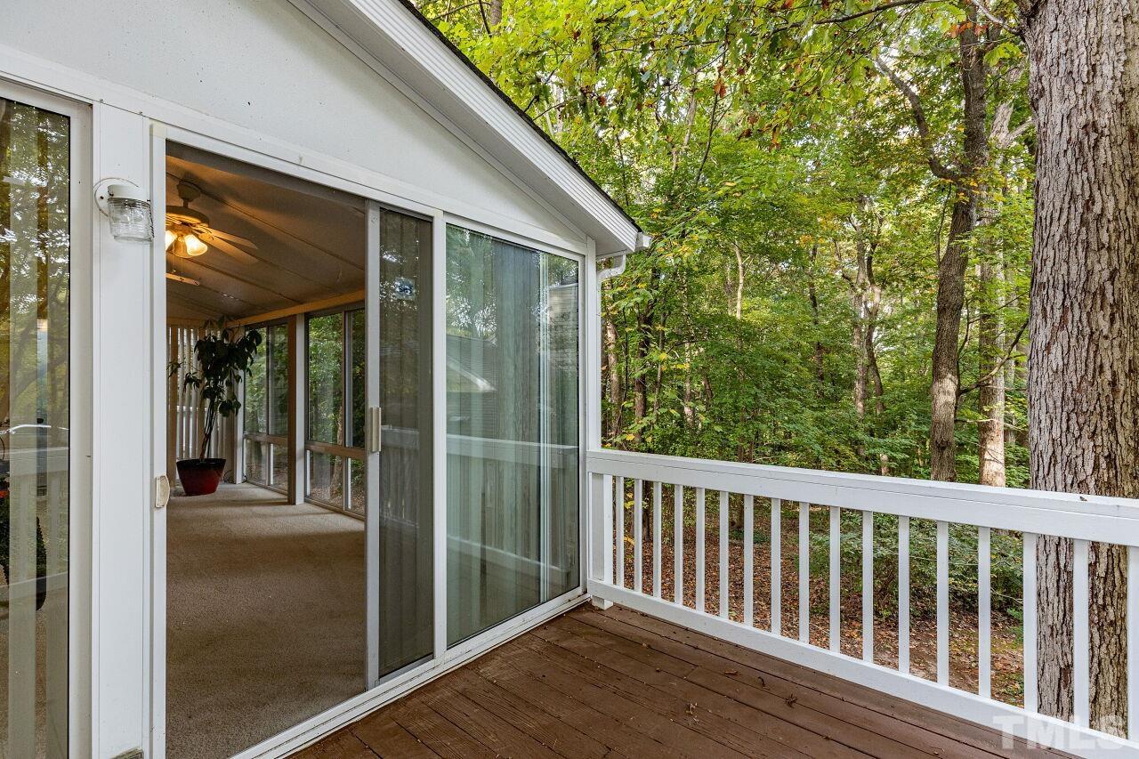 7811 Breckon Way Raleigh, NC 27615 - Photo 29 of 30 a view of balcony with floor to ceiling window and wooden fence