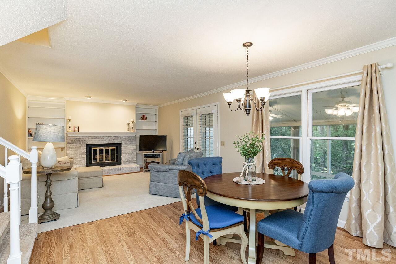 7811 Breckon Way Raleigh, NC 27615 - Photo 8 of 30 a view of a dining room with furniture window and wooden floor